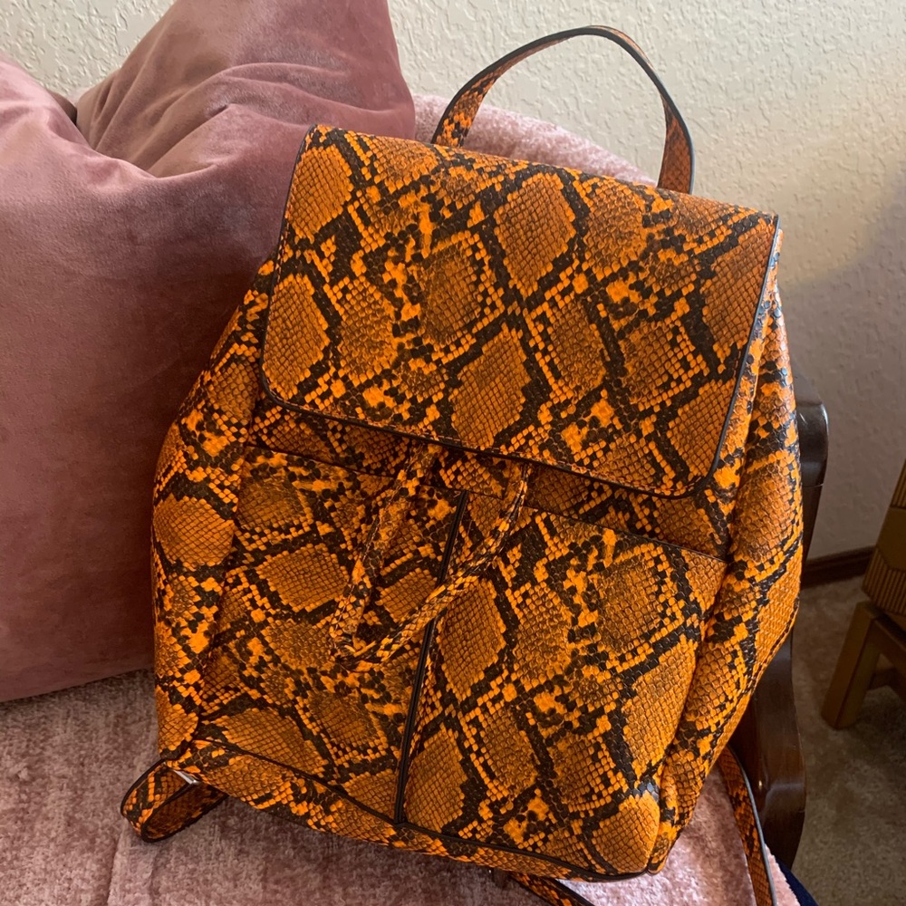 Orange snakeskin backpack